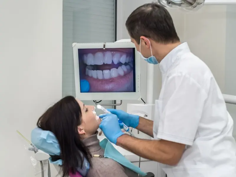 Intraoral camera showing a live view of a patient’s teeth